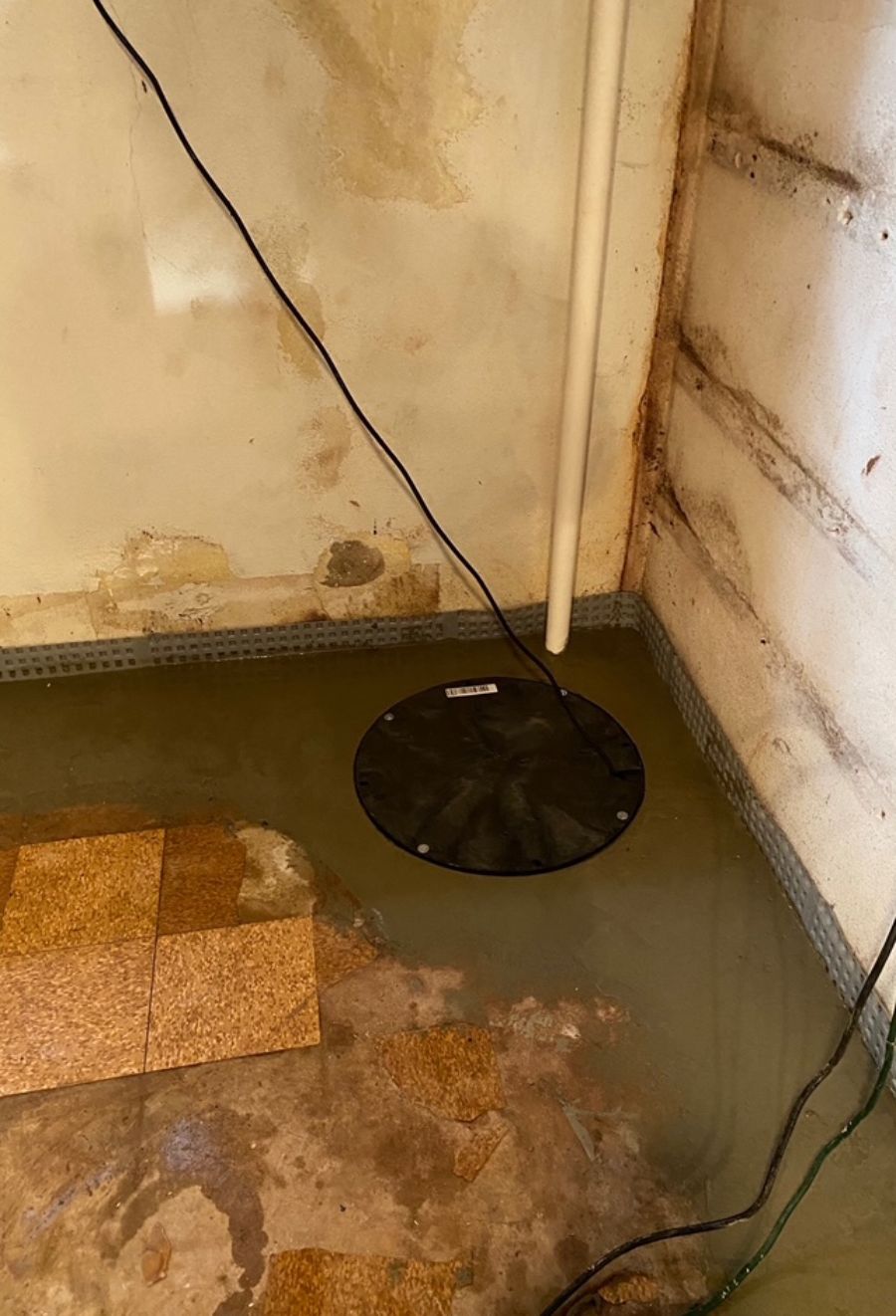 corner sump pump installed in the floor