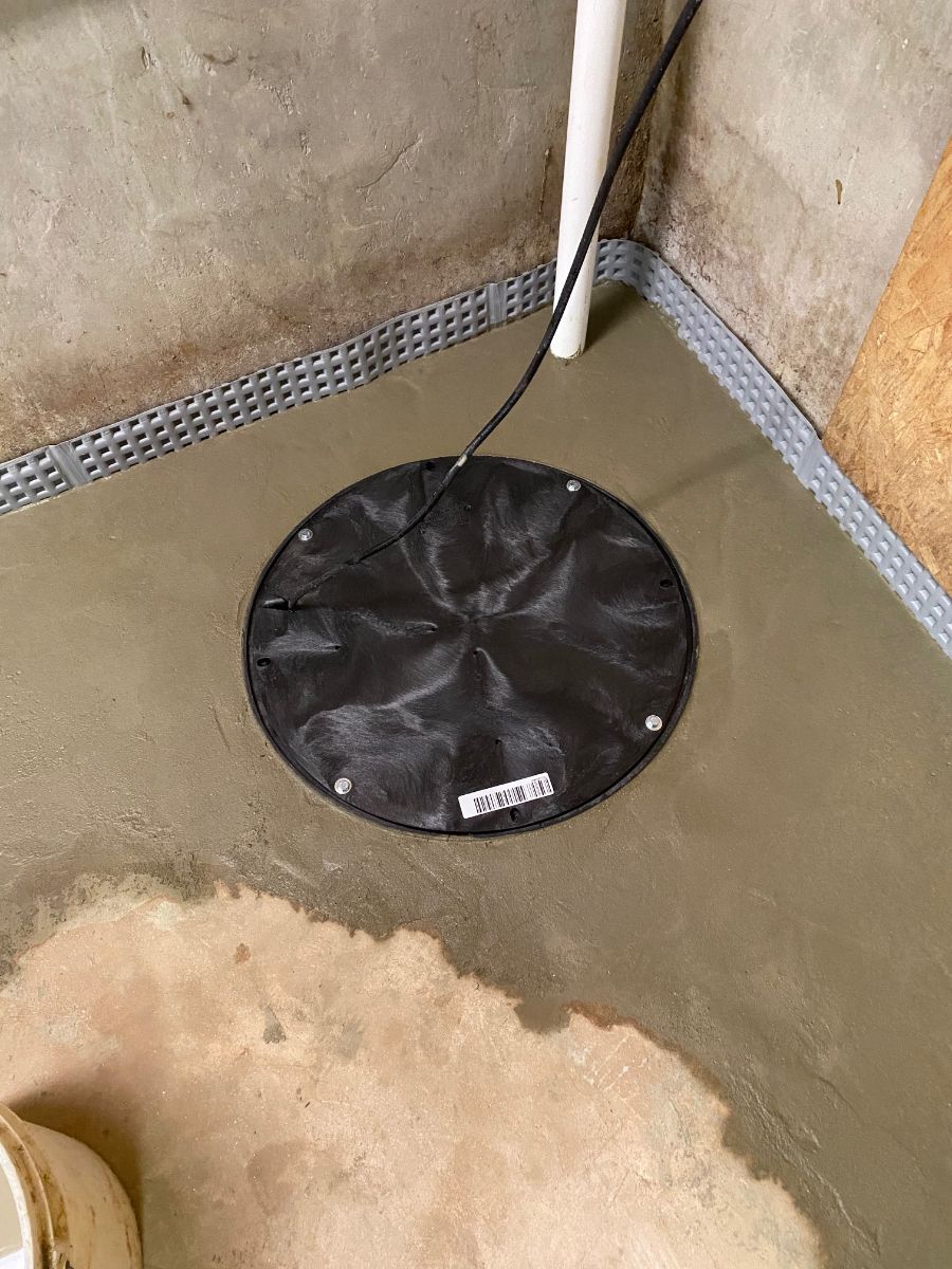 newly installed basement pump in the floor